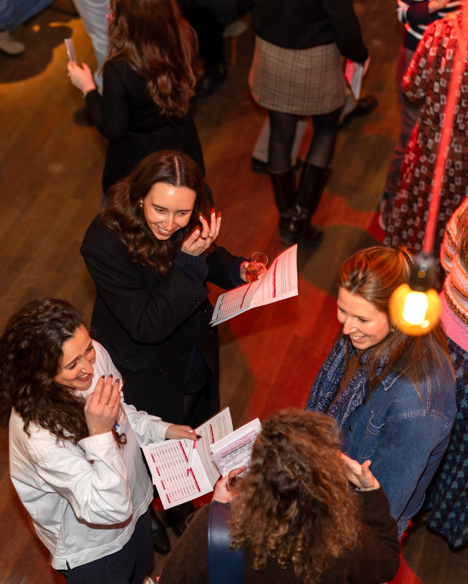 Women chatting and laughing at an impowr event